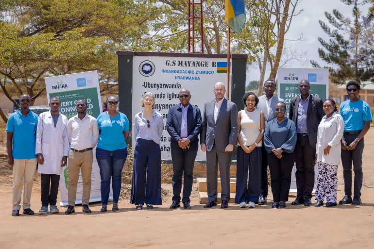 UNICEF and ISHARA partners pose for a group photo outside G.S. Mayange B during a school visit to support inclusive education and strengthen learning opportunities for children in Rwanda.