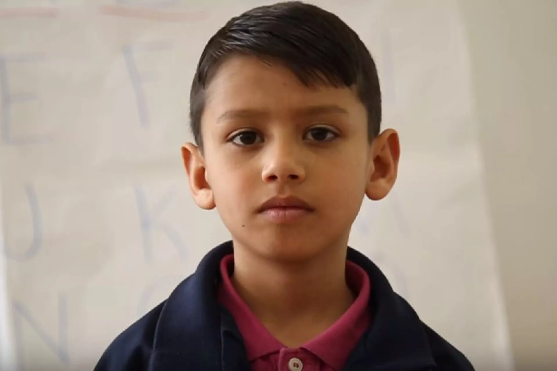 Mustafa looking at the camera