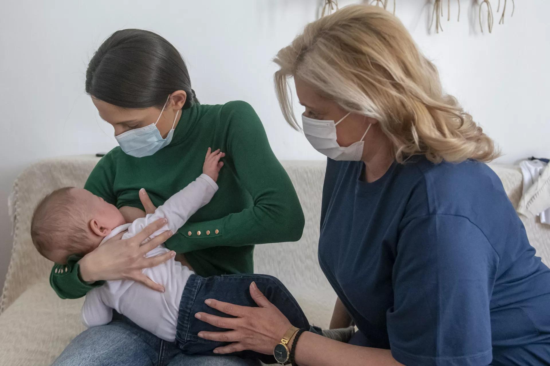 mom and child and patronage nurse breastfeeding