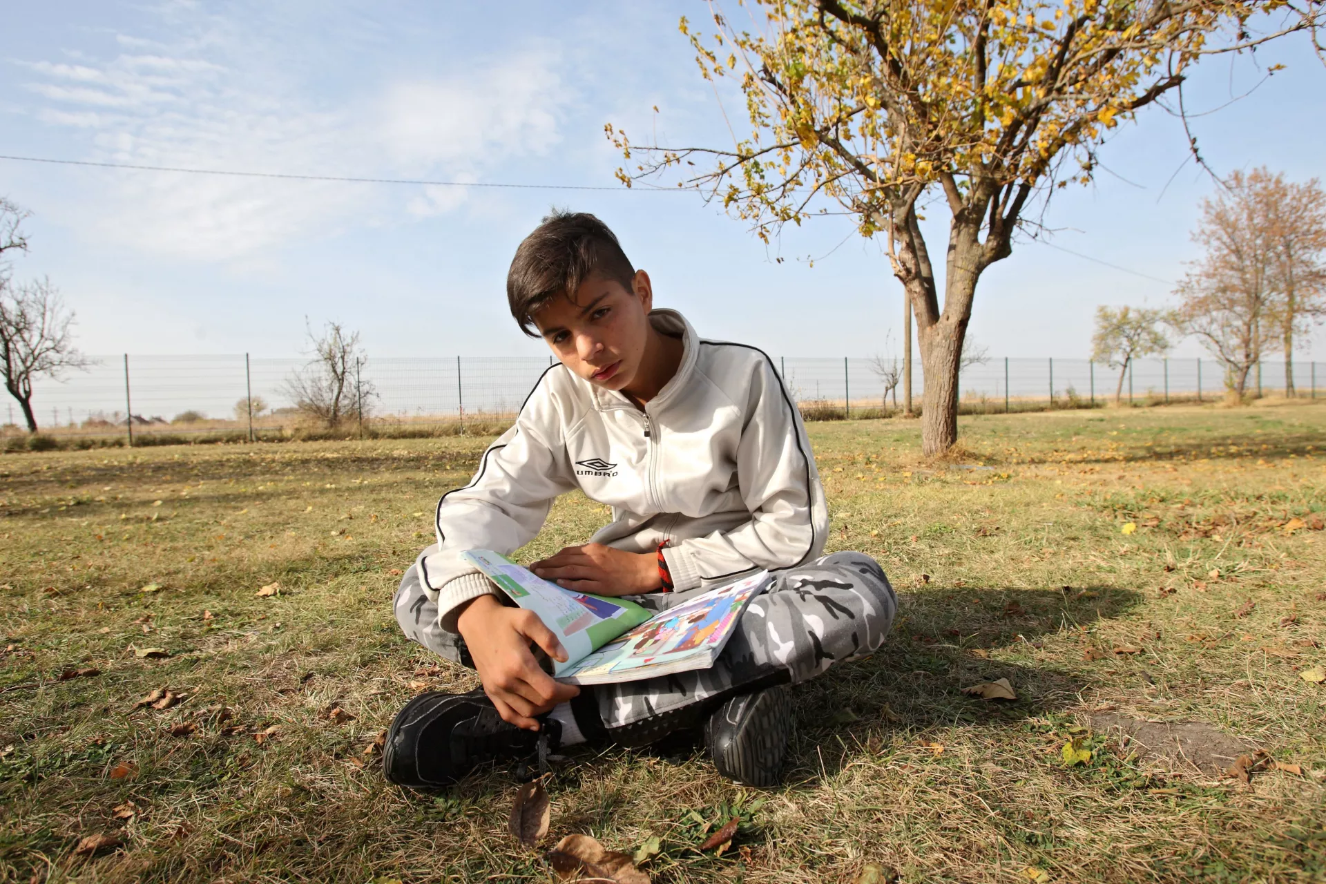 Mohamed Tajik (13) with his book in Farsi