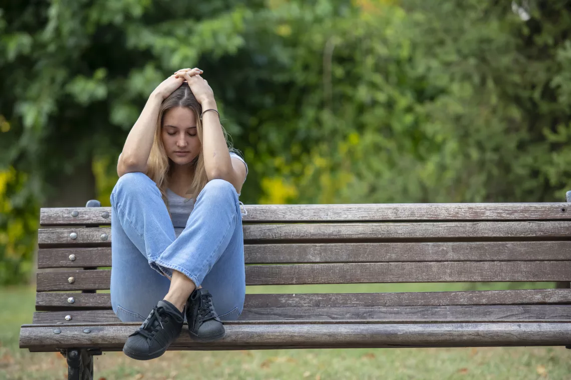 Girl on a park bench