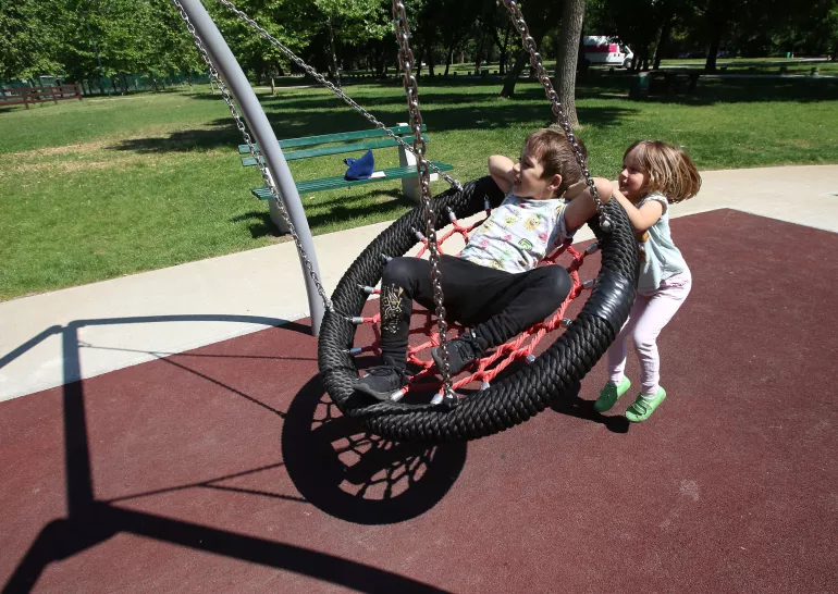 children playing on the inclusive playground
