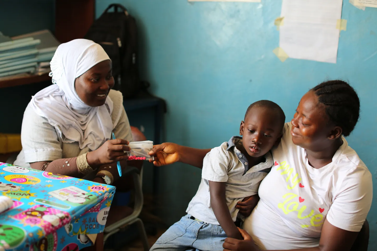 A nurse attends to a child at a health facility in Freetown.