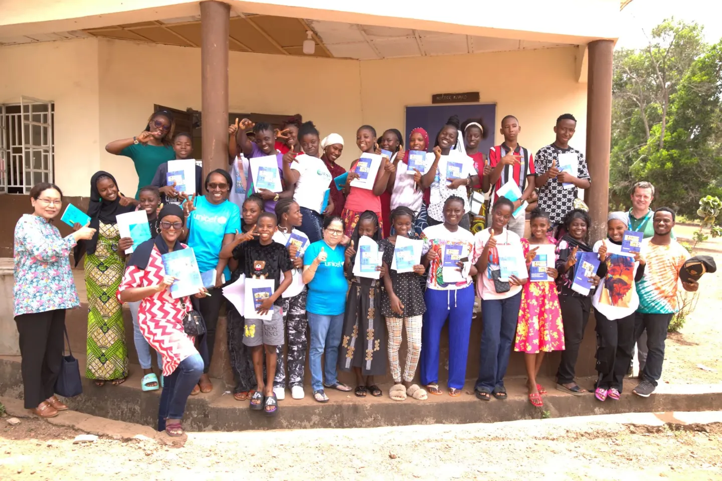 A group of adolescents and some UNICEF Sierra Leone programme staff after their engagement and training on Adolescent, Health, Nutrition and Wellbeing in Port Loko