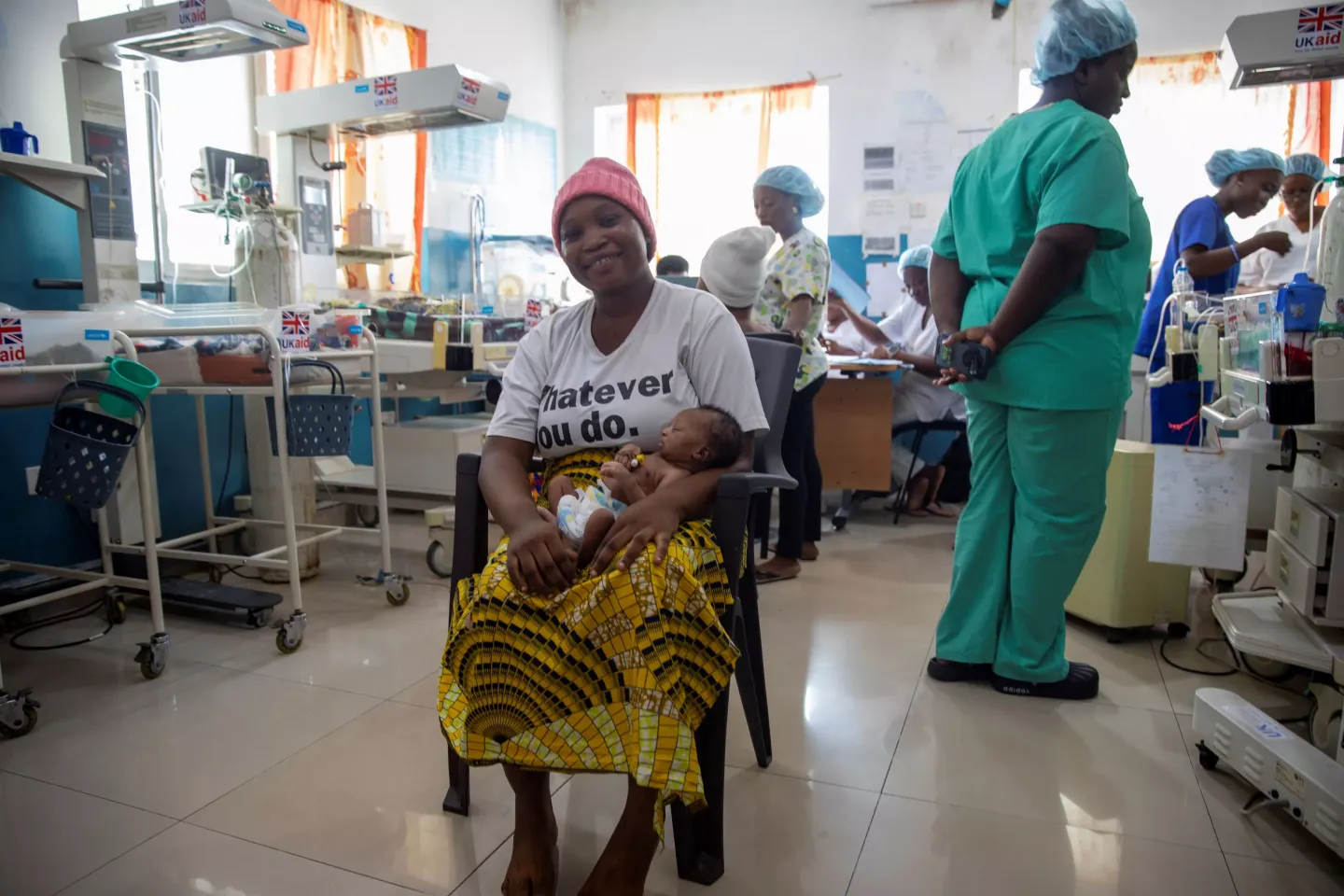 New mom Gloria carries her baby inside the King Harman Road Hospital SCBU.