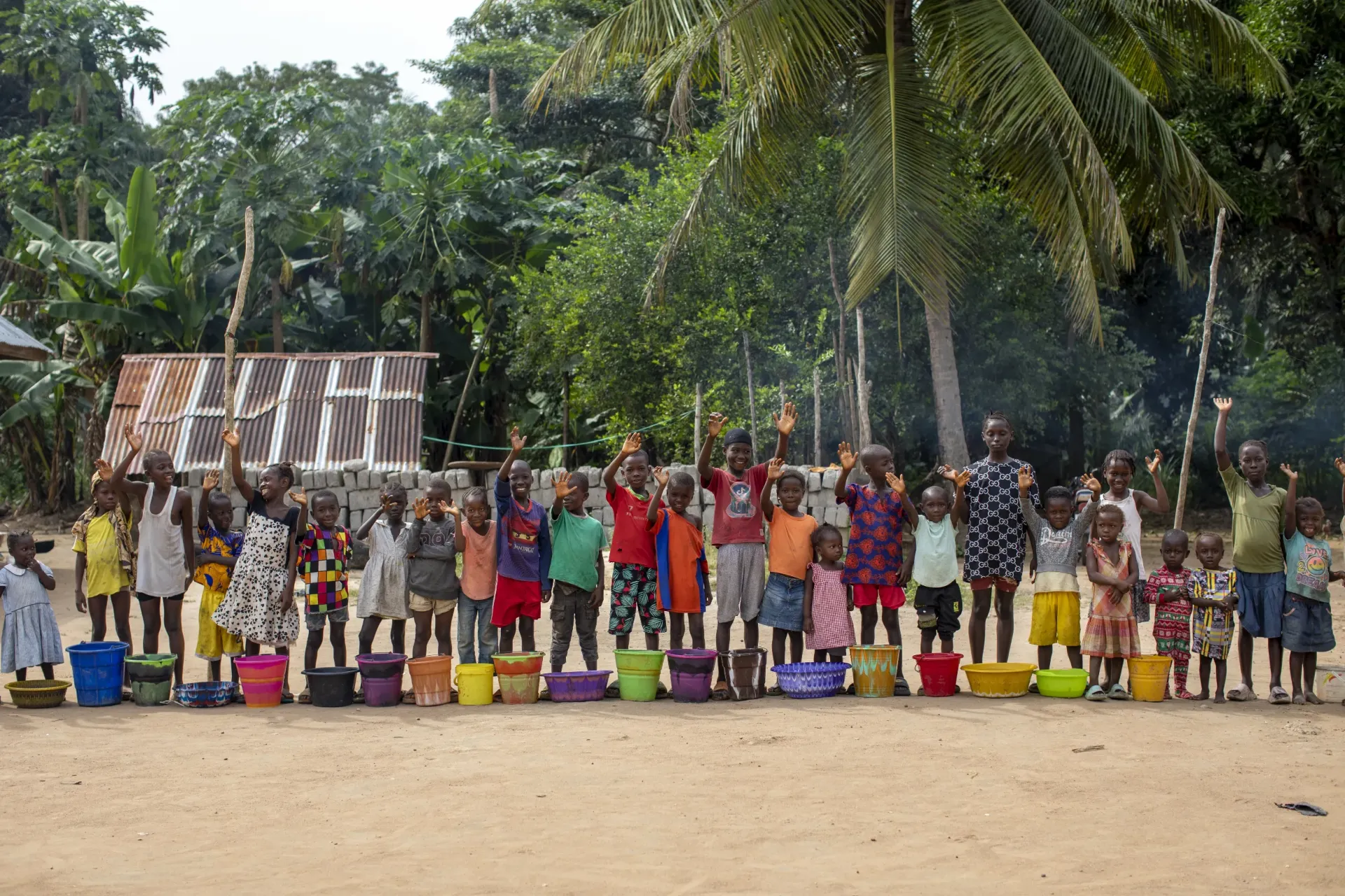 Photo of children in Bombali District in a community in-line close to the water lake