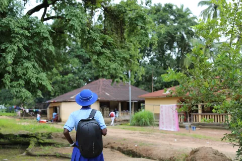 A girls walks in her neighborhood in Tonkolili, northern Sierra Leone