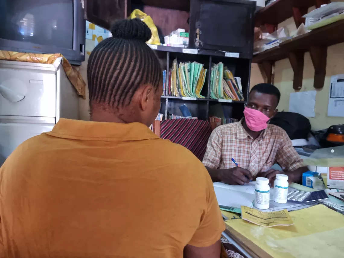 A counsellor talks to a HIV positive person in Freetown, Sierra Leone