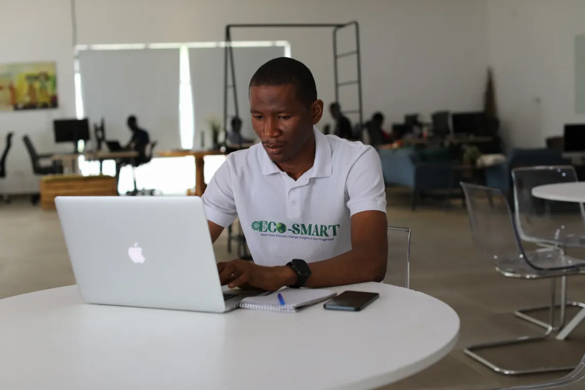Abdulai Barrie, a young innovator, works on an open-source digital solution developed through the Digital Public Goods Accelerator Lab.