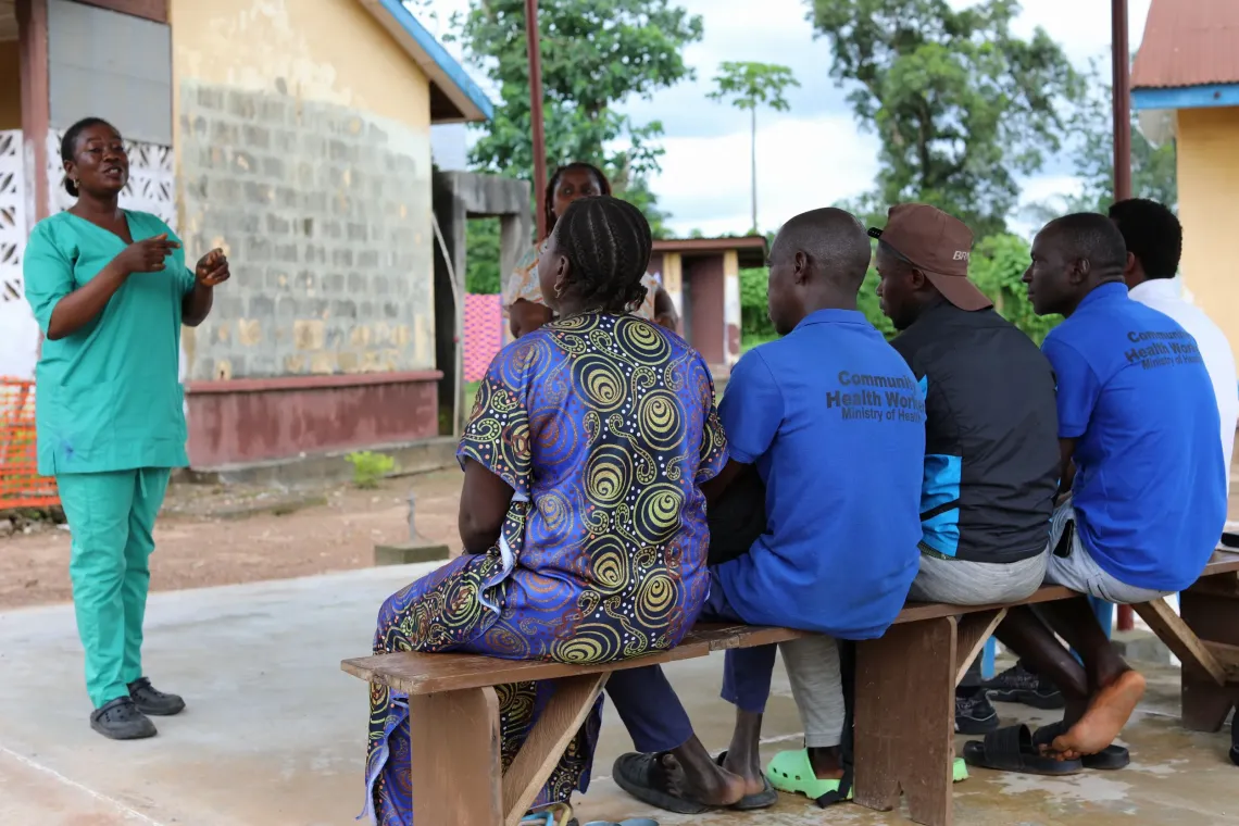 Community Health Officer runs a coaching session for a group of Community Health Workers at the Gbangbatoke Community Health Centre. 