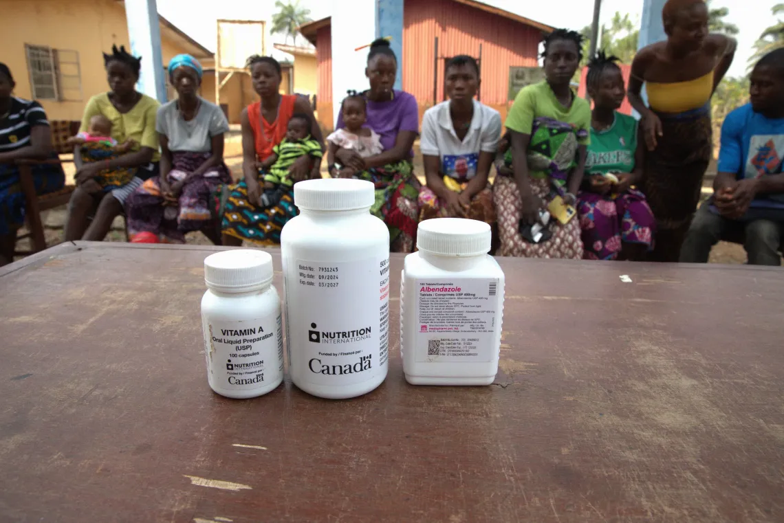 Bottles of Vitamin A supplements and Albendazole tablets on display during an engagement session at the Rokonta Community Health Center. 
