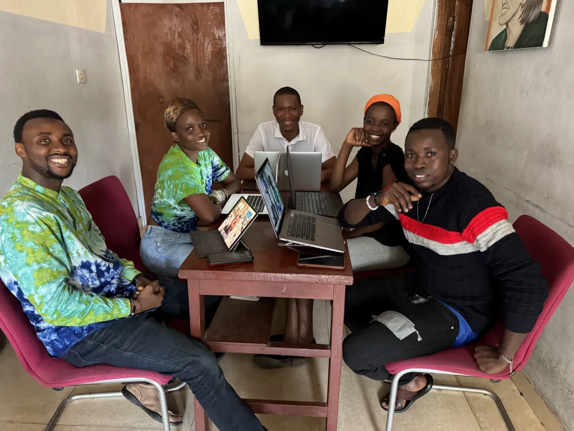 Members of Eco-Smart, a youth-led innovation team, collaborate on an open-source solution designed to address local development challenges.