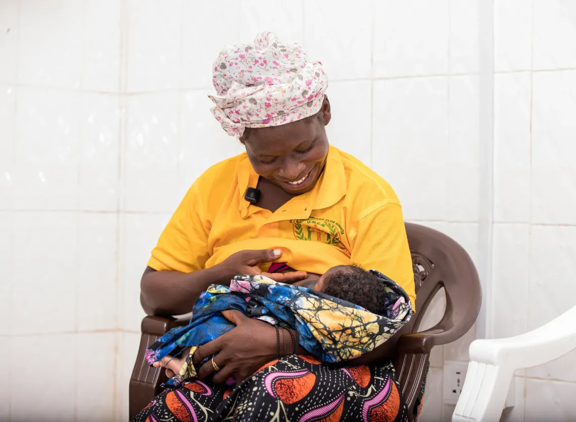 Fatmata Conteh breastfeeds her baby after receiving breastfeeding counselling from health workers at Makeni Regional Hospital.