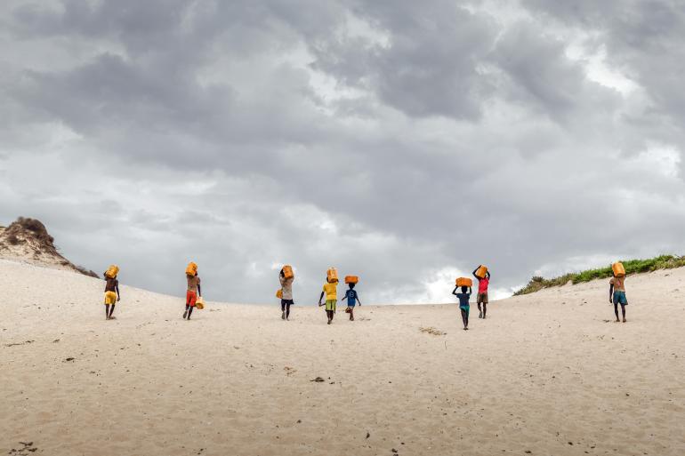 people-walking-to-collect-water