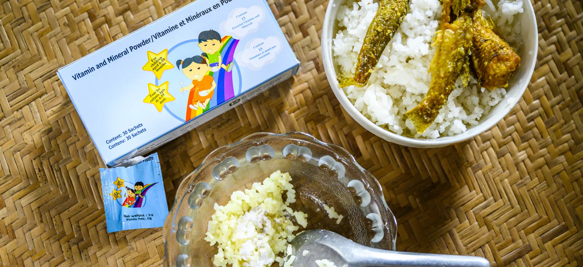 A portion of rice that is mixed with sprinkles of micronutrient powder