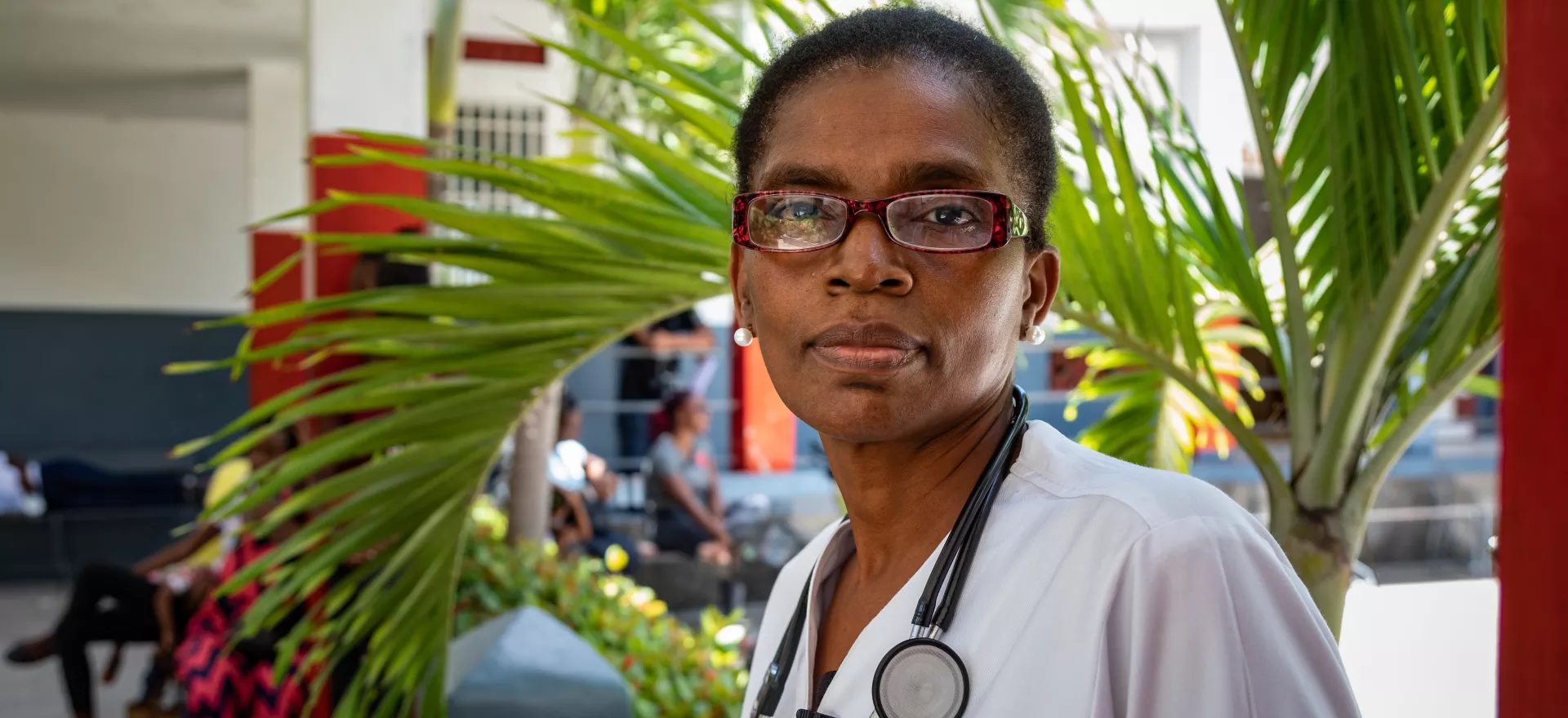 Mona Yvrose Jean-Claude, Director of Sacré-Coeur health centre, poses for a portrait outside Dispensaire du Sacré-Coeur in the Charpentier district of Les Cayes, Haiti.