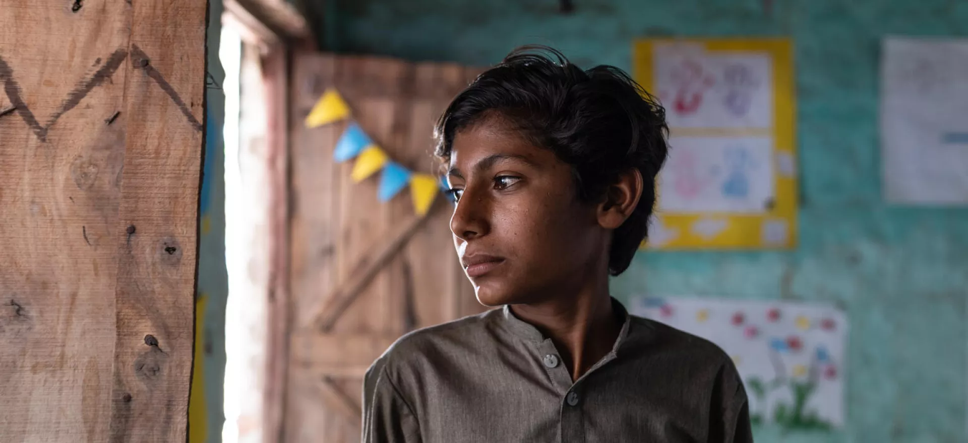 Pakistan. Sanjay, 13, looks out of a window at a UNICEF-supported children&rsquo;s safe space in Umerkot District, Sindh Province.