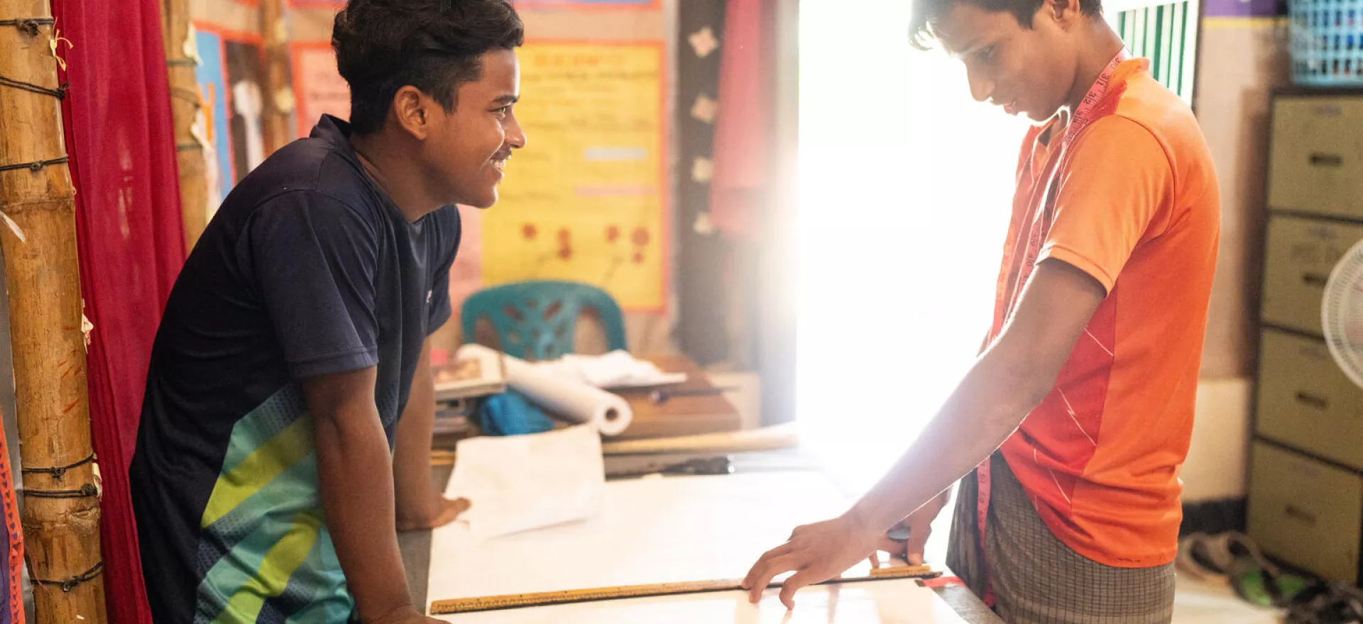 Bangladesh. Nur Kalam, 16, and Saiful Islam, 17, participate in a tailoring workshop at a Multi-Purpose Centre in a Rohingya refugee camp in Cox&rsquo;s Bazar.