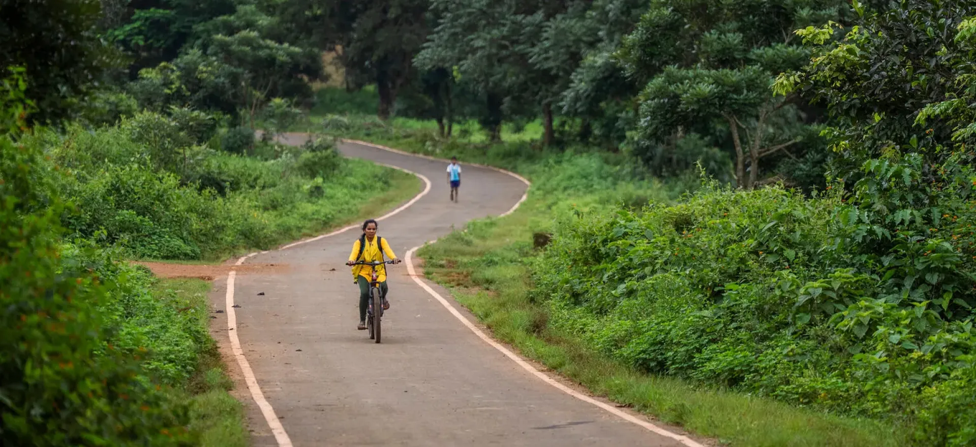 Woman riding bicycle on road