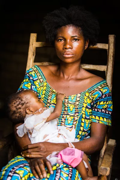 Lusamba Marie Katambua, 27, and her youngest daughter Banyi, 11 months, sit at home in Kananga, Kasai region, Democratic Republic of the Congo, DRC