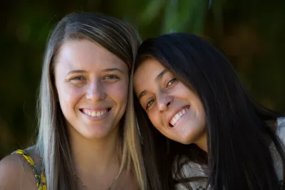 Two young women stand together in Taiobeiras municipality, Brazil. 