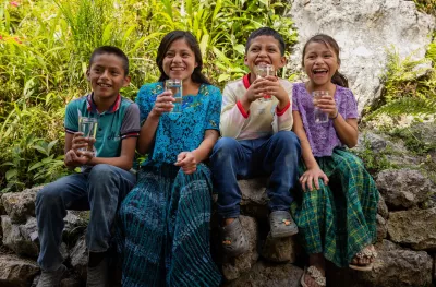 On March 28, 2023, in Caser&iacute;o Pansal, San Crist&oacute;bal, Alta Verapaz, a group of smiling children between the ages of 8 and 13, with glasses of safe water.