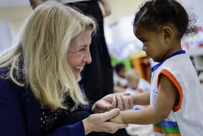 UNICEF Executive Director Catherine Russell greets a young student.