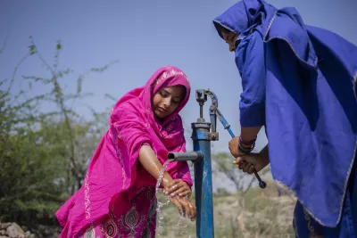 A lack of safe drinking water in the dusty, rural village of Musa Jasser in Umerkot, Sindh Province, meant that 12-year-old Farzana (dressed in Pink) would walk 7 kilometers with her mother to the nearest clean water source, up to three times a day, to collect water for her family.
