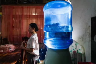 Althea Patino, is seen at her home next to a water container in Siargao, Philippines