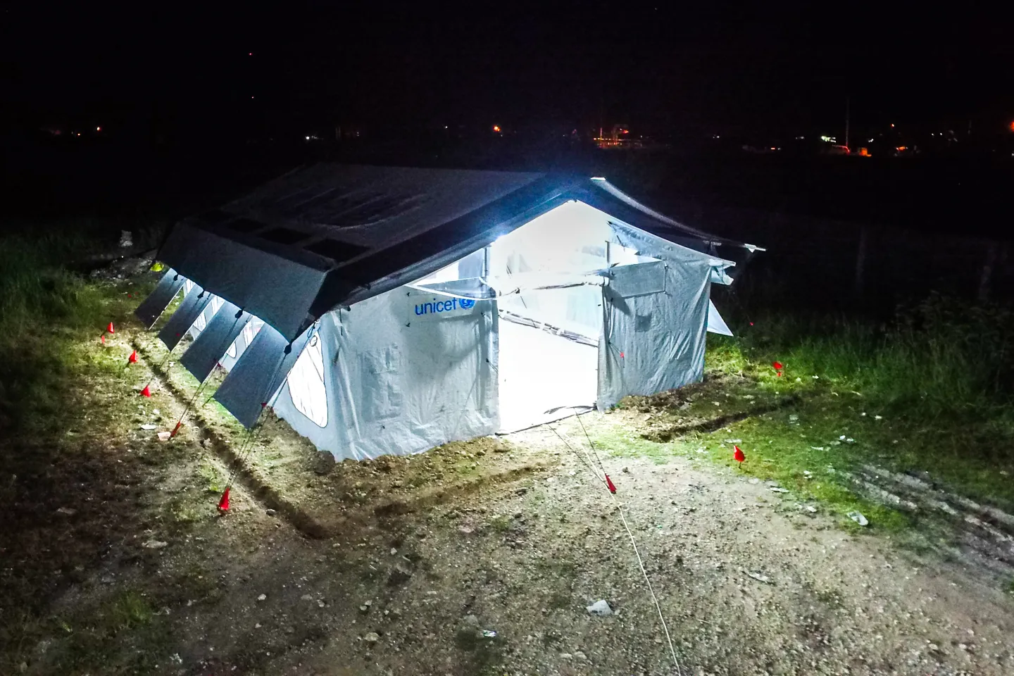 Philippines. Lights shine from inside a prototype of a High Performance Tent being tested in Cotabato.