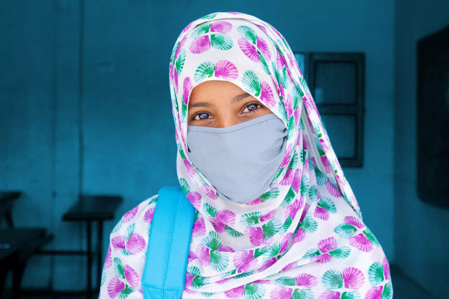A young student wearing a face mask, because of the covid-19 pandemic.