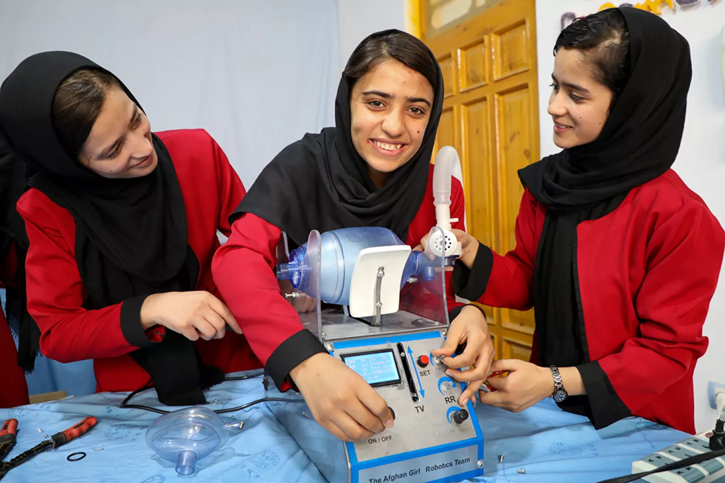 In Herat, Afghanistan, Somaya Faruqi (centre), 17, leader of the &lsquo;Afghan Dreamers&rsquo; girls robotics team, shows how to assemble a bag ventilator device.