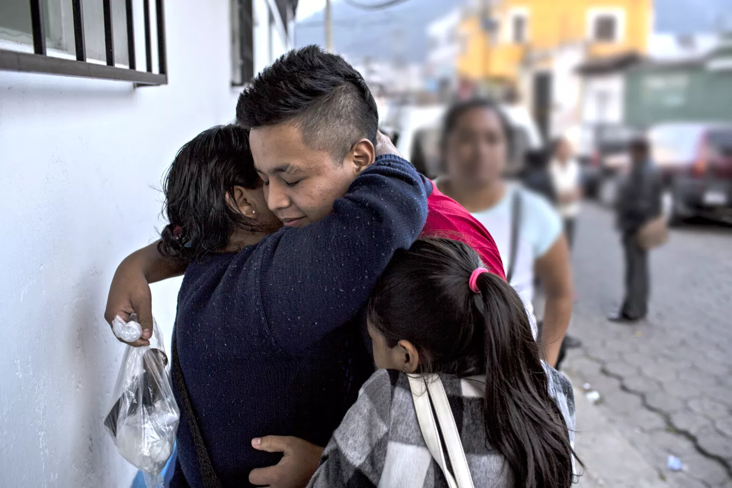 A family embraces, Guatemala