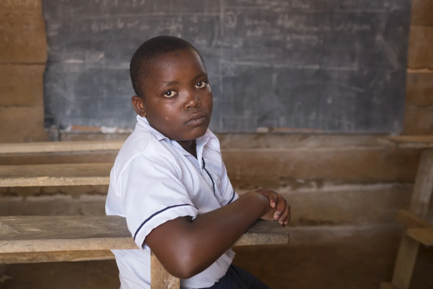 Democratic Republic of Congo. A child sits in a classroom.