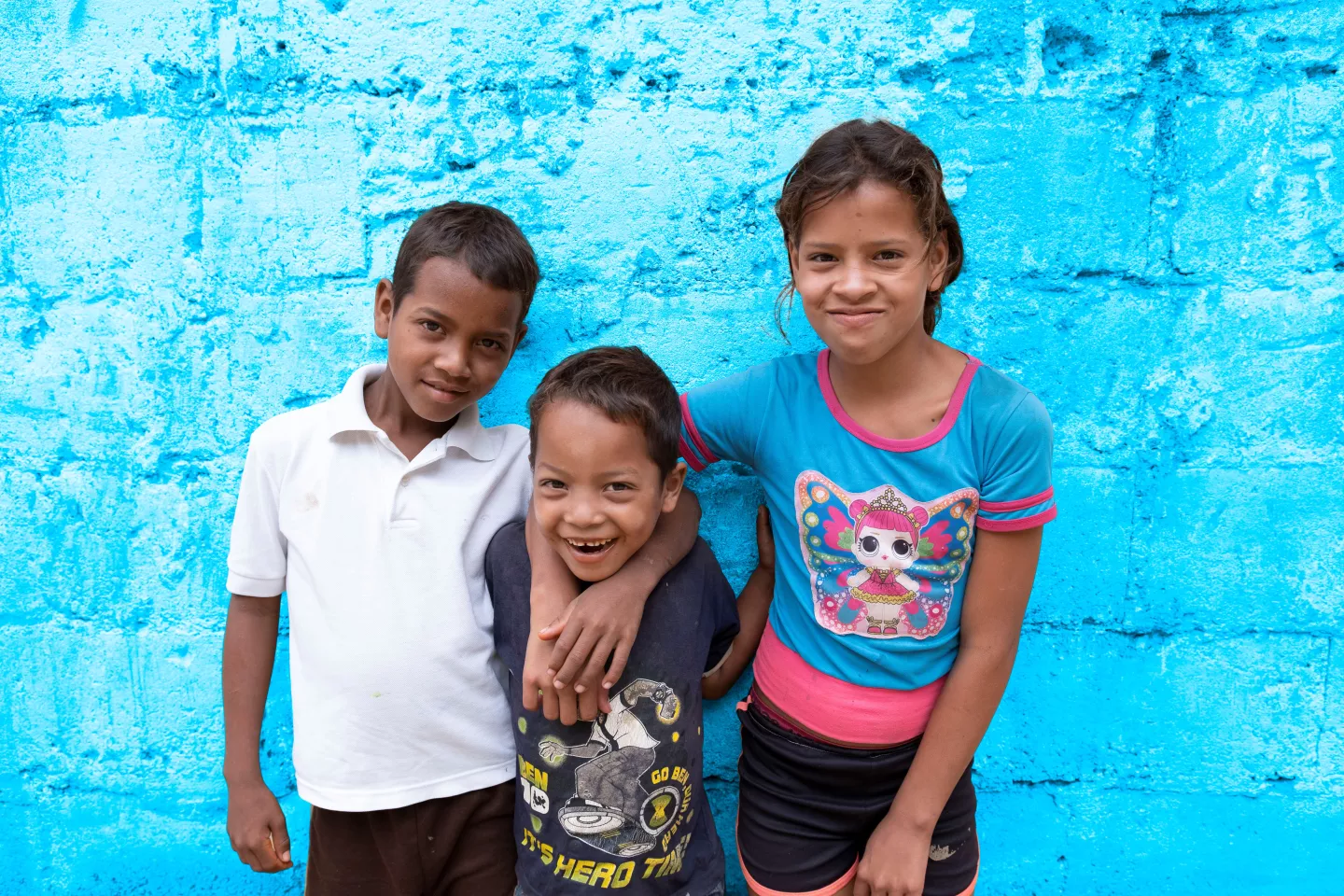 Three children in front of their house in Ni&ntilde;o Jesus neighborhood in Caracas, Venezuela