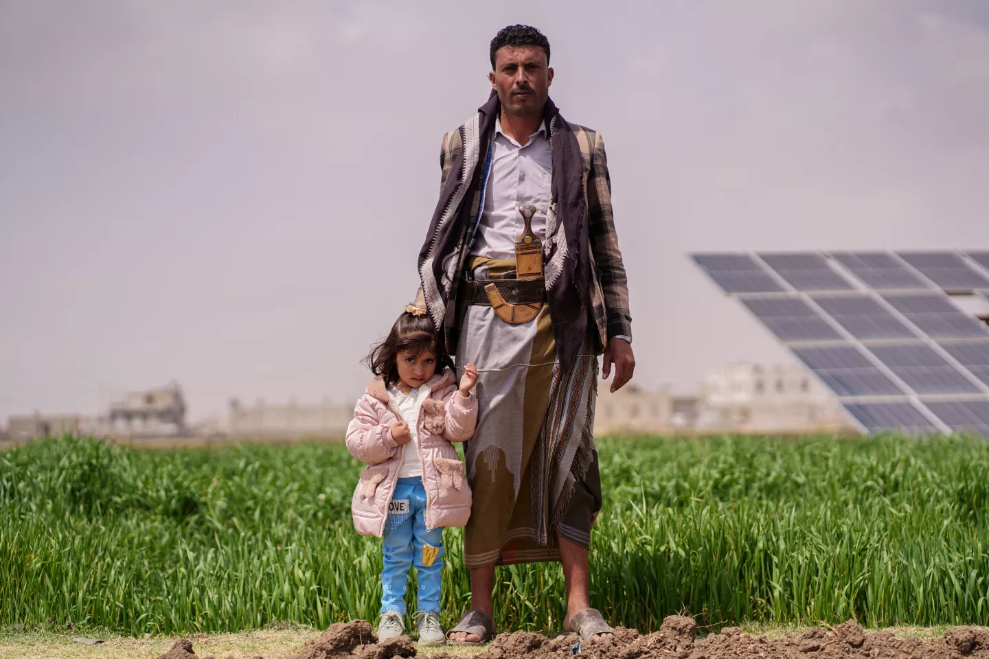 a man poses for the camera with his daughter