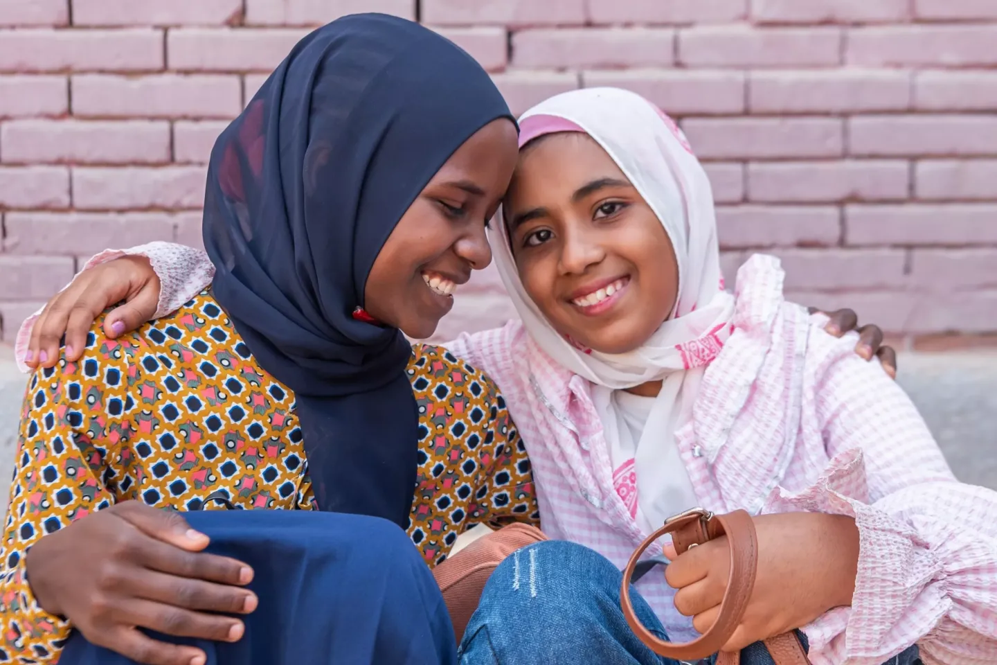 A photo of 2 young women smiling