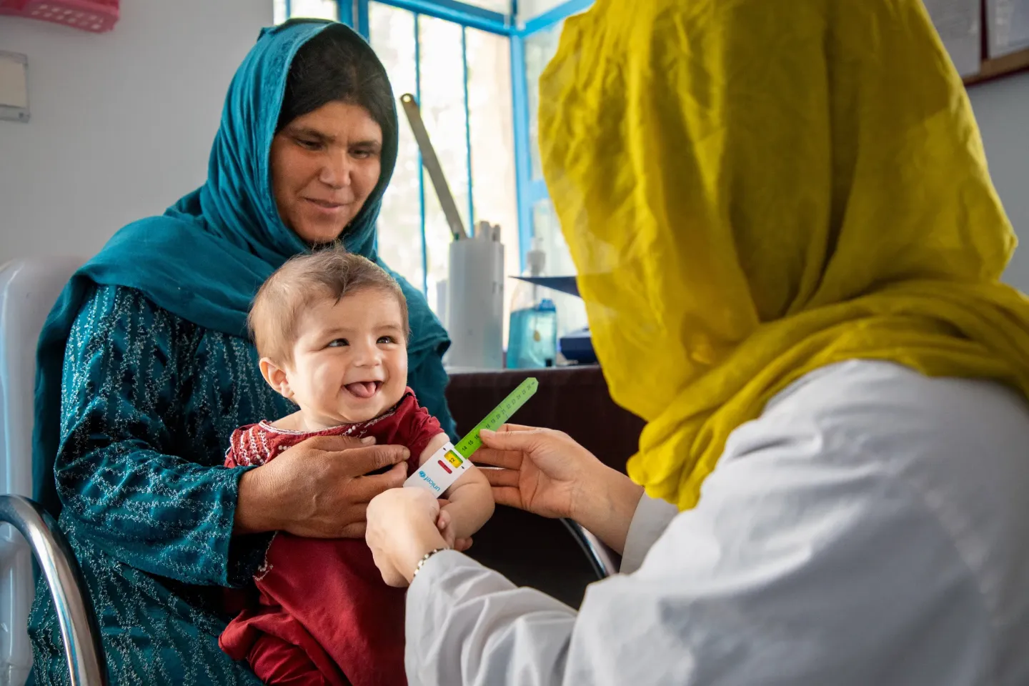 A 7-months baby, being screened by a nutrition nurse 