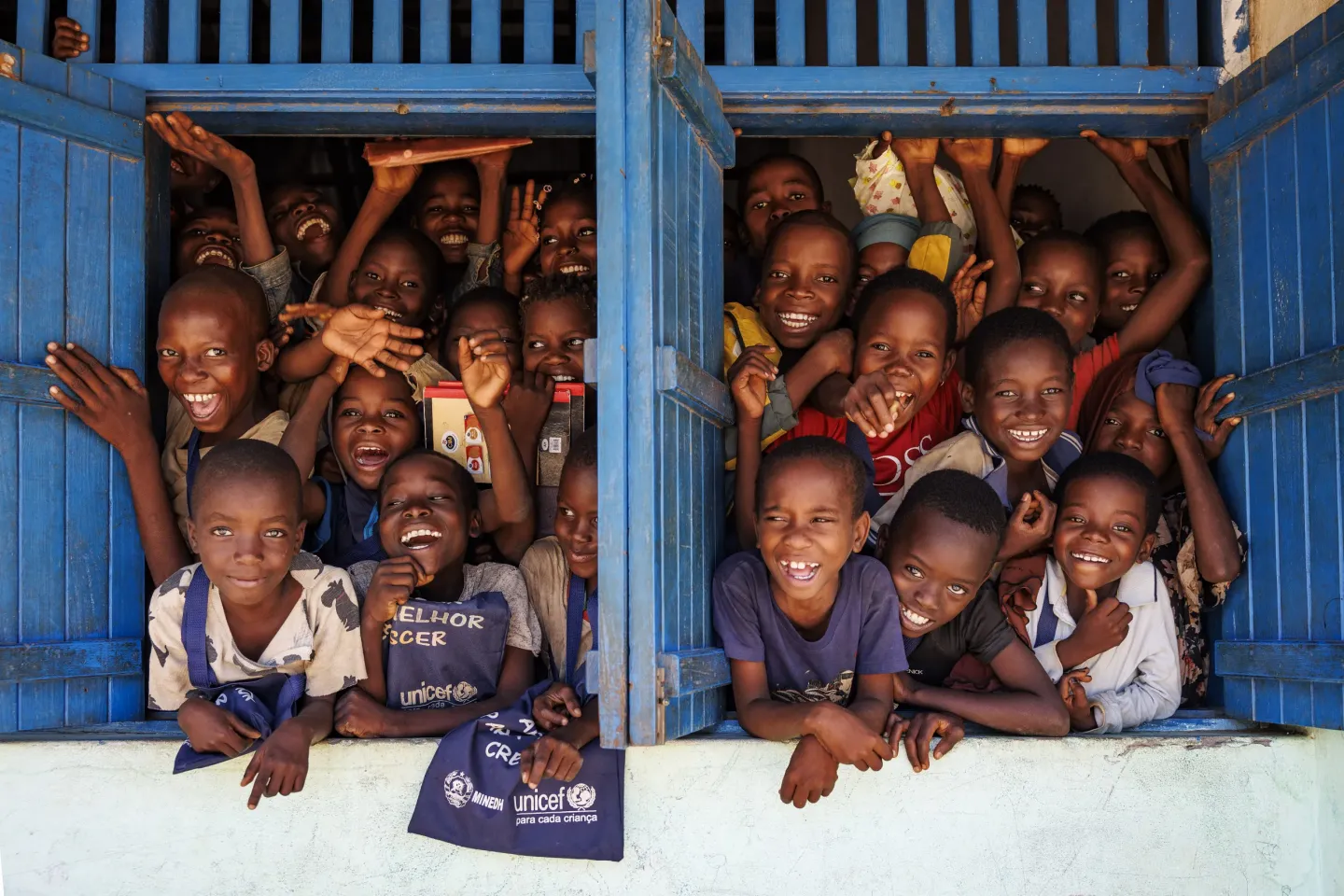 Students by the window of their classroom