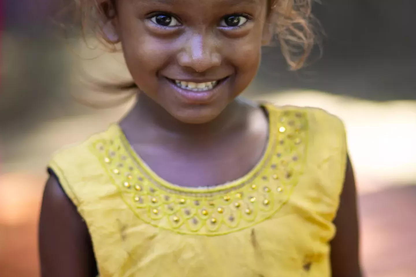 A little girl smiling. 