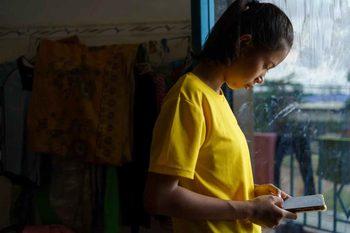 A girl follows an online lesson 