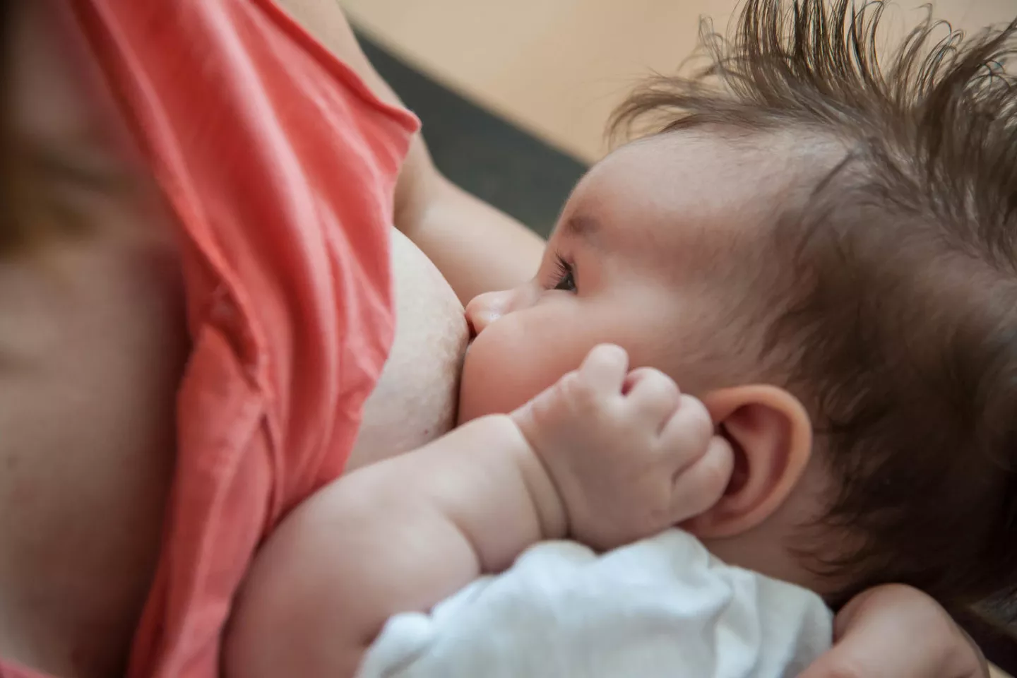 A mother in Serbia breastfeeds her baby in 2017.