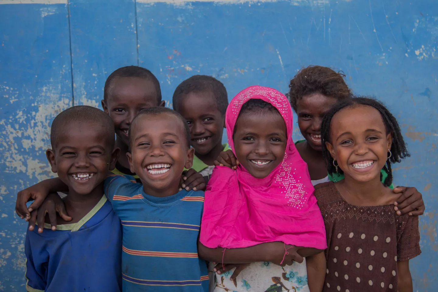 A group of happy children outside the Accelerated School Readiness (ASR) programme at Simbile Primary School, Afar Regional State, Ethiopia on 20 September 2018. 