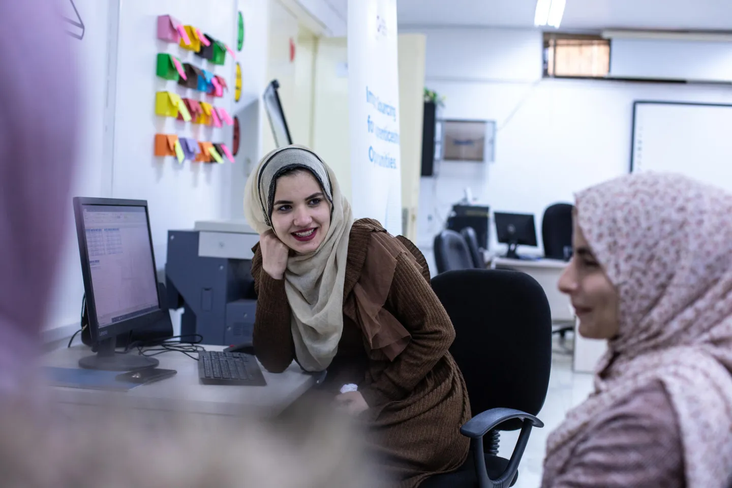Monia (left) is a Jordanian university graduate from Tafileh who enrolled in the UNICEF-supported digital skills training.