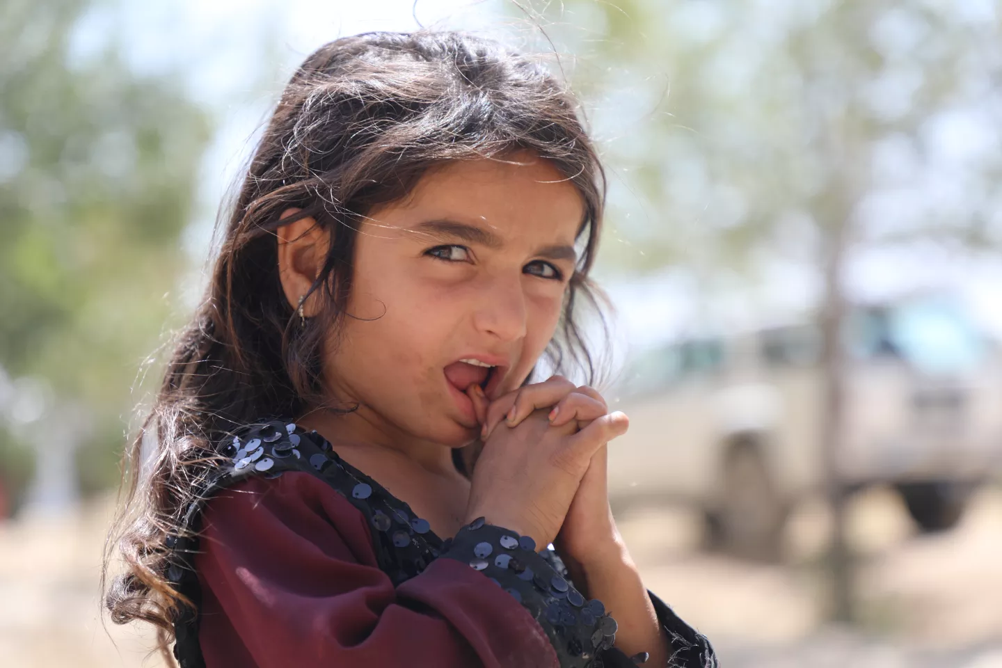 A young girl stands outside in Kabul, Afghanistan, in August 2021.