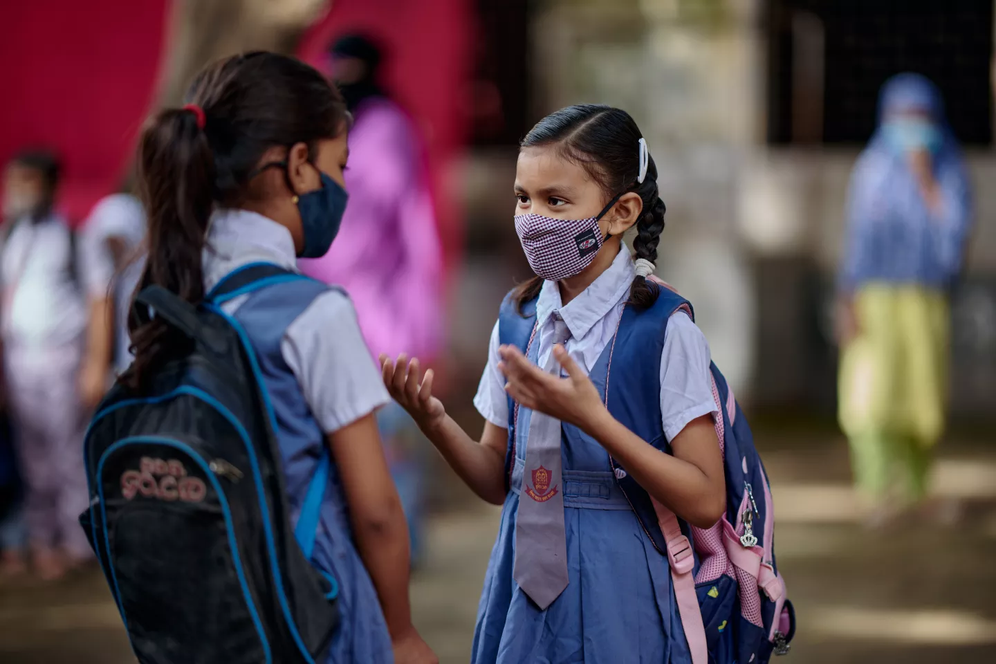 Student well-being: Two friends are reunited after a school reopens in Dhaka, Bangladesh.