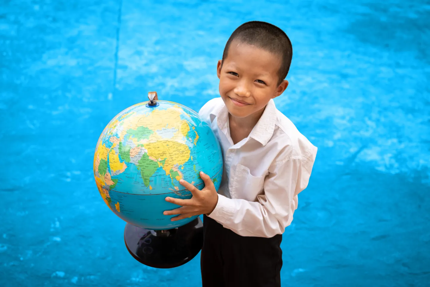 boy-holds-globe