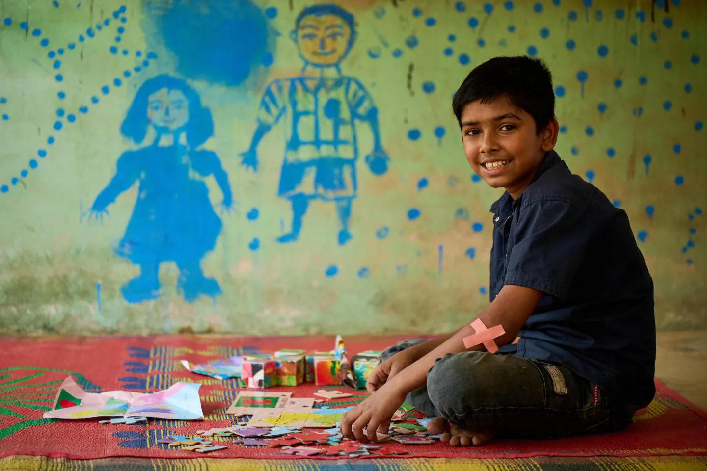 A boy works on a craft project in a UNICEF-supported centre at a camp for Rohingya refugees in Cox&rsquo;s Bazar, Bangladesh.