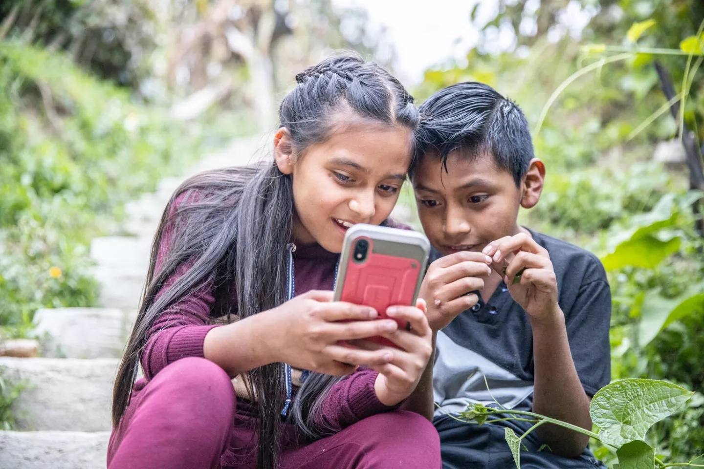 On August 27, 2021, Ilda Sofia Vasquez and Brandon Vasquez, both10 years old play outside while their parents participate in a workshop supported by UNICEF about online security and positive parenting practices in Nikajkim Comunity, Utatlan, Solola Guatemala.