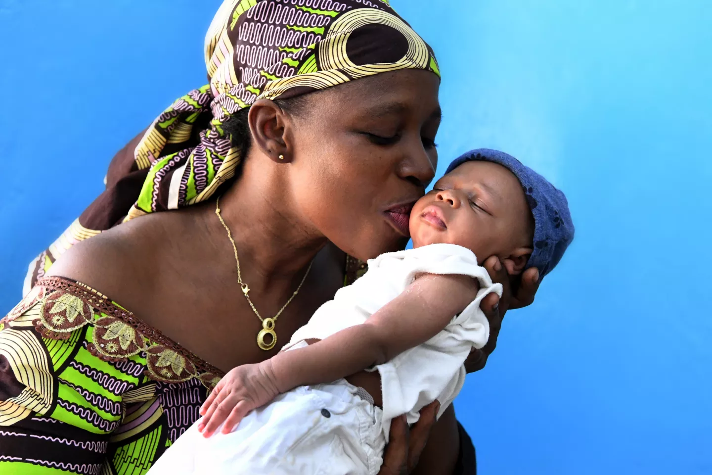 mother kissing her baby